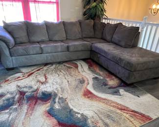 Newer grey sofa with lounger and 9x12 (approx) area rug