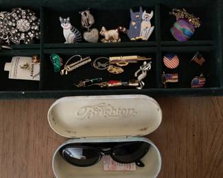initial display of costume jewelry, with Brighton sunglasses