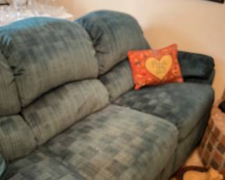 Teal sofa with recliner on each end