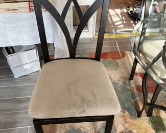 one of 4 black wrought iron chairs