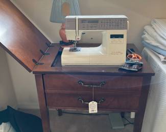 New Home Memory Craft Sewing Machine in cabinet