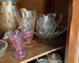 Close up of items in previous glass curio cabinet - top shelf