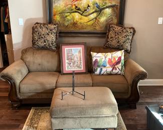 Sofa, cushions, pictures, foot stool, small rug