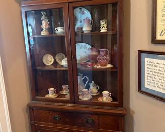 Corner cabinet with collectibles