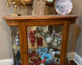 Glass cabinet with collectible items 