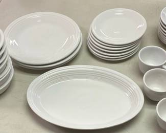 Fiesta Ware platter, 3 Plates, 7 Bowls, 5 Mugs, 8 Saucers, 7 Salad Plates