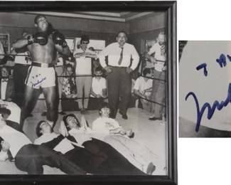 Autographed photo of Muhammad Ali knocking out The Beatles