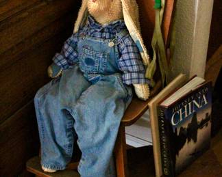 Vintage bunny with overalls...lots of vintage decor with unique antique wood chair 