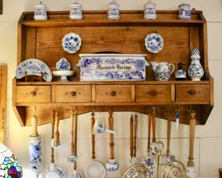 Antique hanging kitchen cabinet with vintage kitchen utensils 