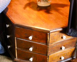 Octagonal antique hardware nuts and bolts storage cabinet with many organizational drawers
