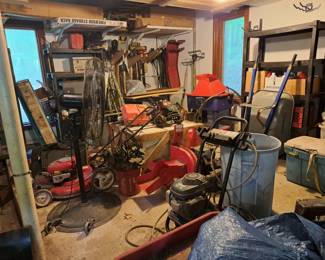 Some of the garage stuff including pressure washer, wood chipper two air compressors, mower, and more . better photos later as we organize garage.,