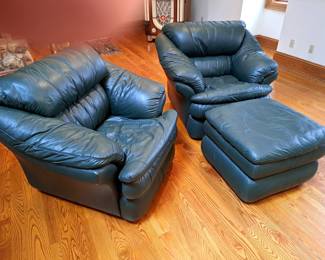 Leather look chairs and ottoman.