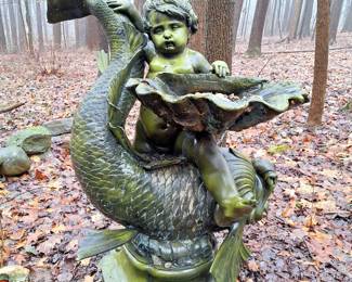 Solid bronze cupid and dolphin water fountain.
