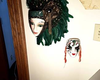 One of two matching porcelain wall hangings.