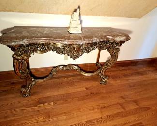 Brass with marble top French Renaissance hall table.