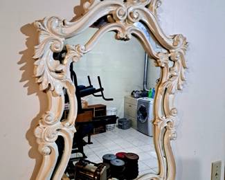 Ornate wall mirror.