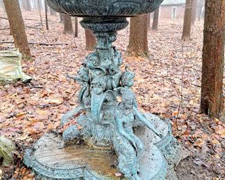 Bronze outdoor garden fountain with classical figures around base. measures about 55 inches high.