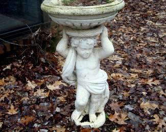 Classical  bird bath with cupid.