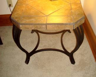 Granite top lamp table with wrought iron base.