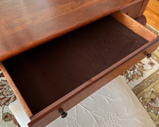 There is a drawer on each end of the Bob Timberlake Table