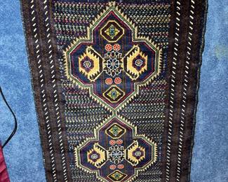 One of several vintage handmade rugs
