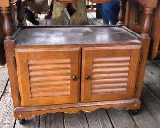 This cute cabinet has dropleaf sides