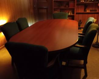 Oval conference table with twelve chairs.  96"Lx48W.