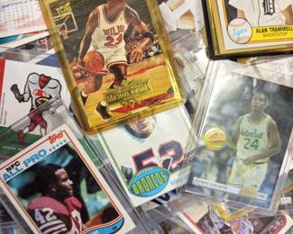 There are 100's of baseball, football, etc., cards.