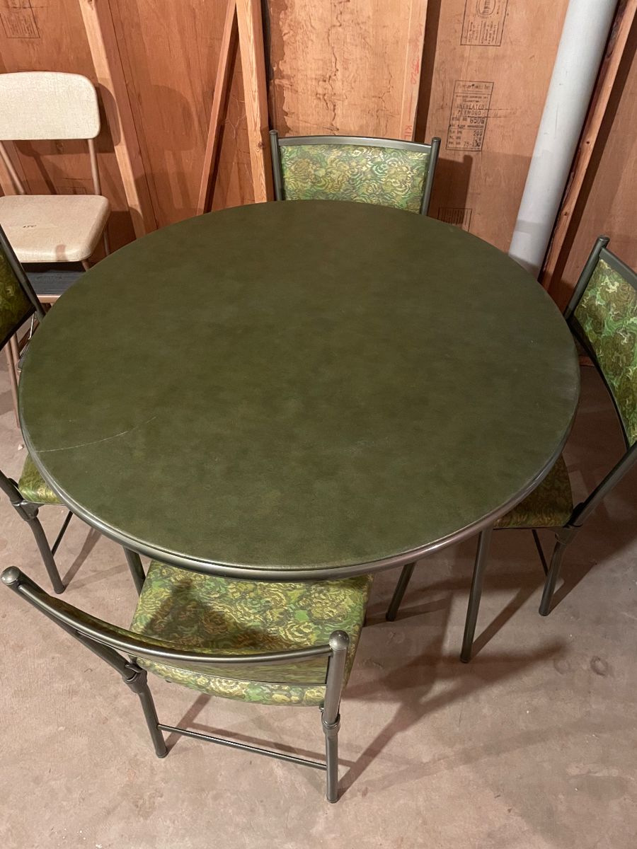 Never used card table and chairs. Table top is soft