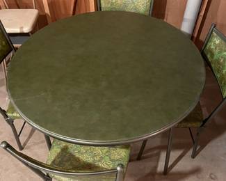 Never used card table and chairs. Table top is soft