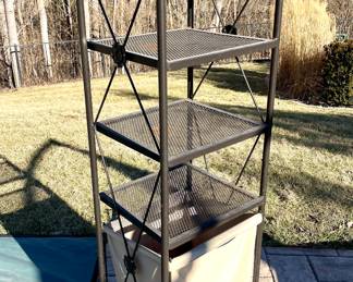 $100. Outdoor towel/storage shelf with hamper. 55”tall by 16” width.
