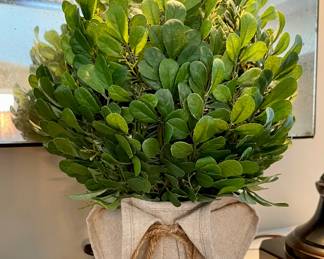 SOLD   Faux greenery in decorative burlap covered container 7L x 11H. There are two of these.