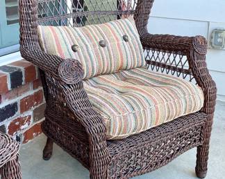 SOLD—Two available. Outdoor wicker Wingback chair, cushions included.42” height, 30”width, 22” depth.