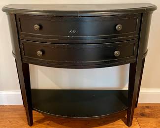 SOLD—Black Demi lune occasional table. Light distress look. Minor wear to front. 38 by 14 by 32 inches. 