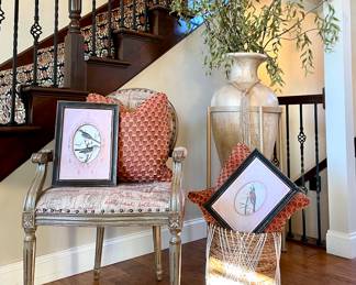 $300 Distressed gray upholstered armchair with nailhead trim by Uttermost Design, (originally $895.) 24L x 21W x 37H.  SOLD—Down filled custom pillow (there are two of these) 18L x18H. SOLD—Champagne colored faux glazed statement vase 20W x 47H. SOLD—each, framed bird prints.