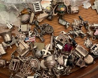 Lots of charms.  Some sterling.  Sold at $4.00 each and will not be discounted on Saturday.