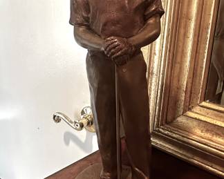 Tall bronze golfer
