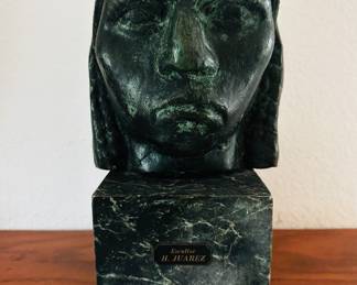 Cast metal bust on marble/stone stand, signed H. Juarez