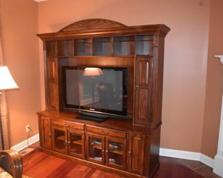Entertainment Center, 87" tall, 80" wide, the opening for the TV is 37" tall and 53.5" wide, the cabinet is 20" deep at the base and the top is 12" deep, the top can separate from the base.  Bring friends to help move, it is heavy.  TV is a 46" Plasma.