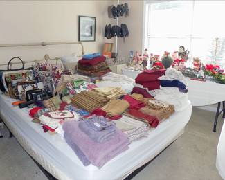 Queen Sized bed.  Bed linens, purses, shoes, Christmas items.