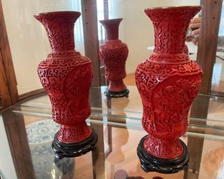 A pair of vintage Chinese Cinnabar carved vases with stands