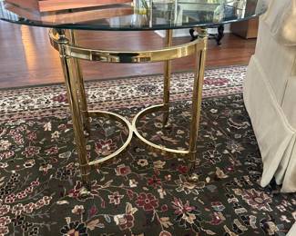Hollywood Regency beveled glass brass footed table