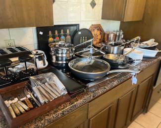 Lots of high end cookware and fun trays