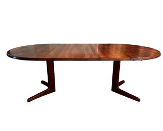 Teak dining table with leaves inserted