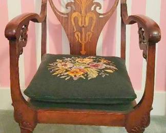 Antique Carved Wooden Chair With Casters and Needlepoint Seat