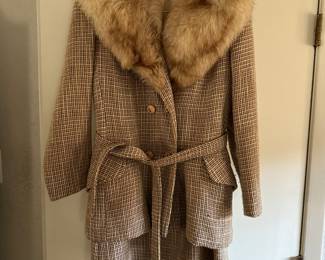 Plaid suit with fox collar.