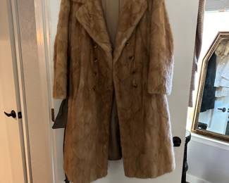 Knee length mink coat.