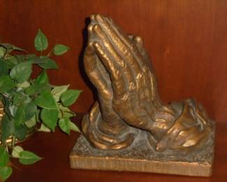 Cast praying hands