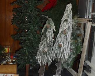 Various skinny tabletop Christmas trees 