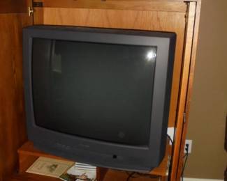 Wood entertainment cabinet w/slide out doors. 